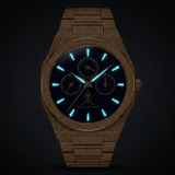 Melrose Haze frosted gold watch with luminous blue hands and markers in the dark.