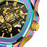 Close-up of Malibu Savage neo chrome watch with a gold skeleton dial and iridescent case.